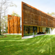 Illustration for article titled This Modern Home Frames the Winery Around It With Weathered Steel
